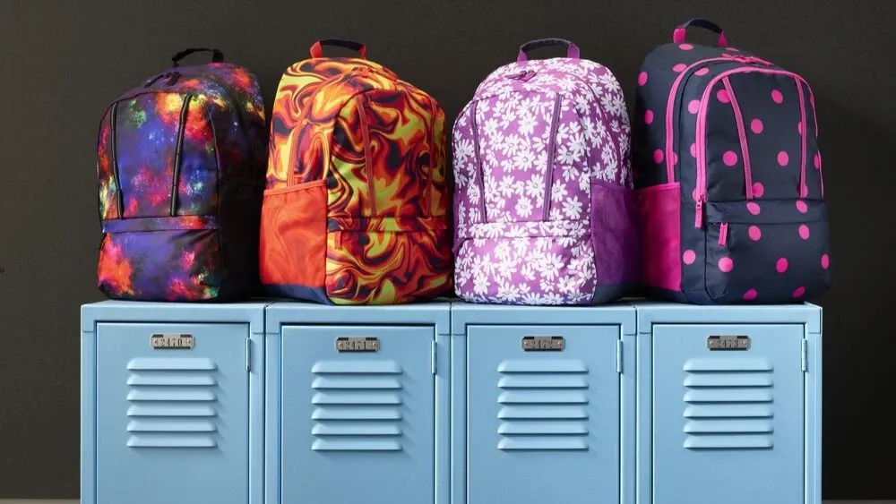 Four Lands' End backpacks on top of school lockers.