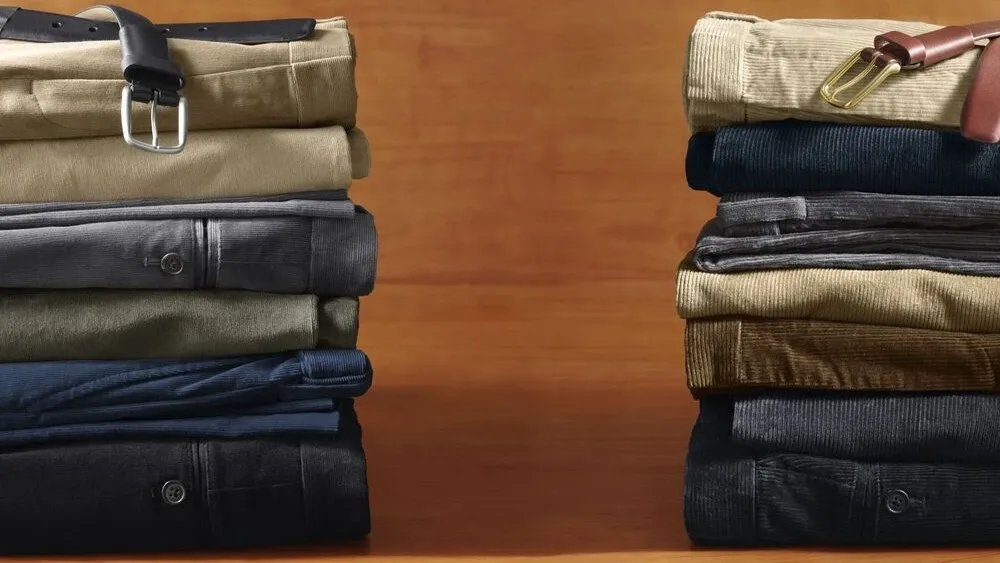 One stack of folded Lands' End dress pants and one stack of folded corduroy pants.