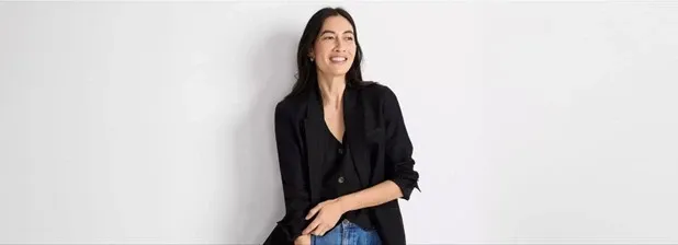 Woman wearing a black buttoned blazer.
