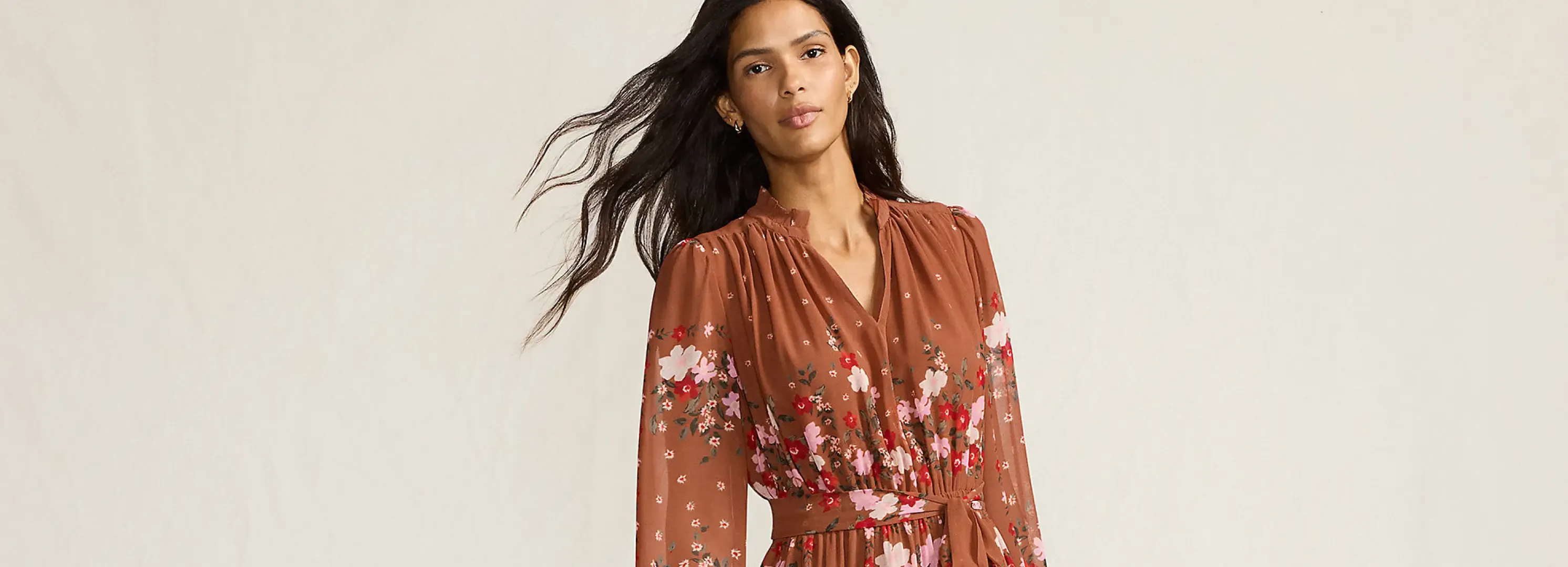 Woman wearing a brown dress.