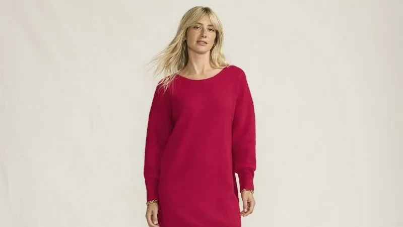 Woman wearing a red sweater dress.