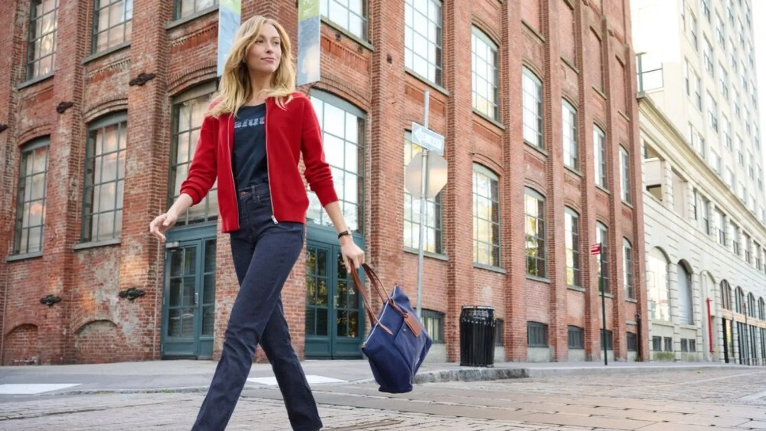 Woman wearing denim high rise flare jeans.