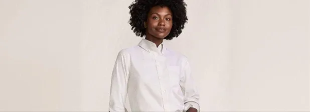 Woman wearing a white button-down shirt.