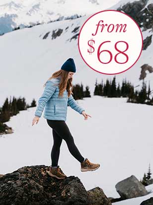 Woman wearing a jacket, pants, boots and a hat