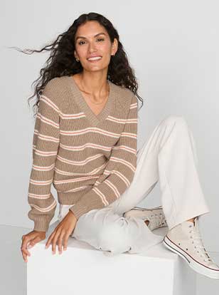 Woman wearing a sweater and pants