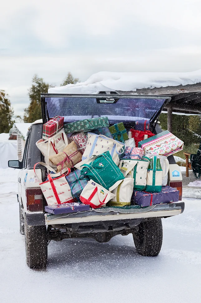 Truck filled with gifts and canvas totes