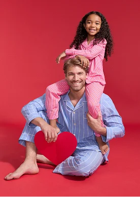 Man and girl wearing pajamas