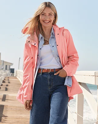Woman wearing a Squall jacket, shirt and jeans