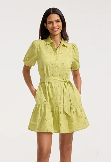 A woman wearing a yellow green dress.