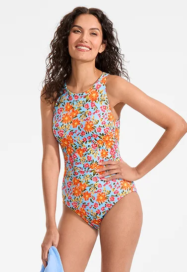 A woman wearing a floral pattern swimsuit.