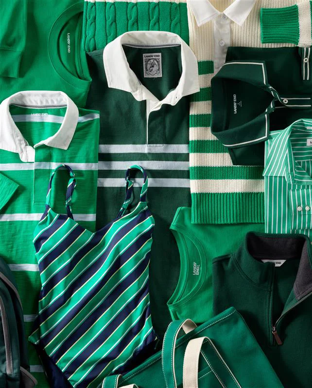 Assorted green polos, sweaters, tees, totes and swimwear