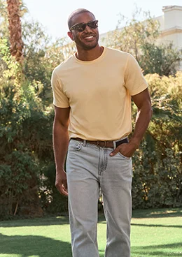 A man wearing a yellow t-shirt.