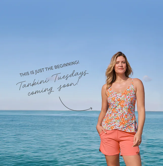 A woman wearing a floral pattern tankini.