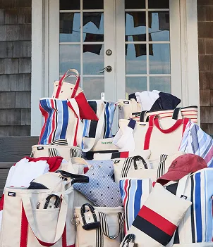 A pile of canvas totes with various patterns.
