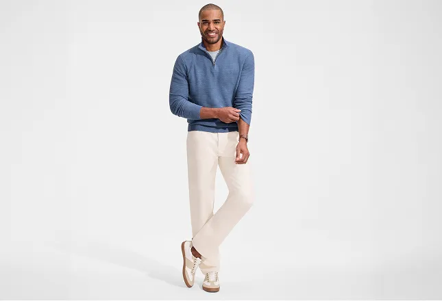 A man wearing white denim pants.