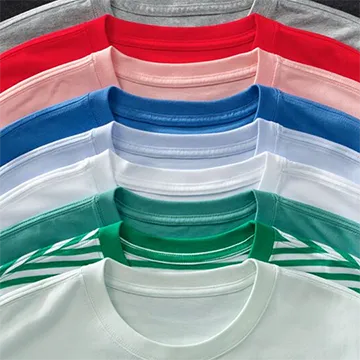 A stack of t-shirts in different colors and patterns.