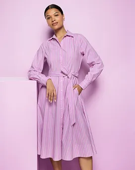 A woman wearing a pink dress.
