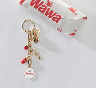 A WAWA keychain and wrapped sandwich.