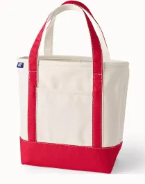 A canvas tote with red accents and handle.