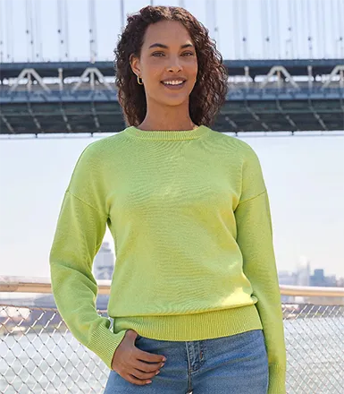 A woman wearing a green Drifter top.