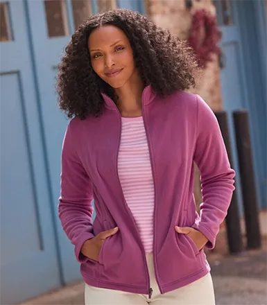 A woman wearing a pink fleece top.