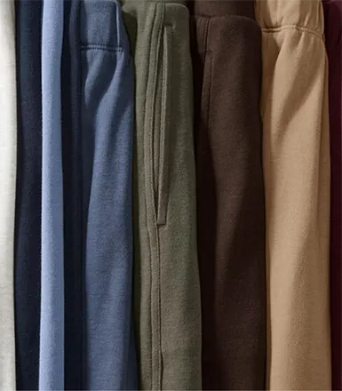 A folded stack of Sport Knit bottoms in different colors.
