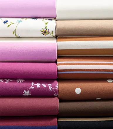 A folded stack of supima cotton clothing.
