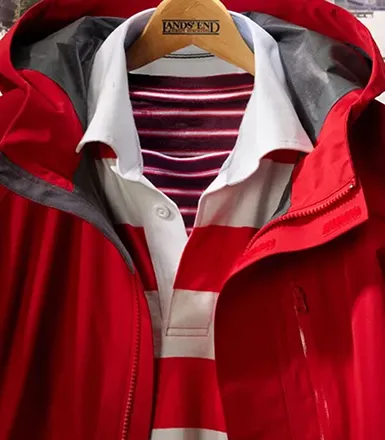 A red squall jacket on a hanger.