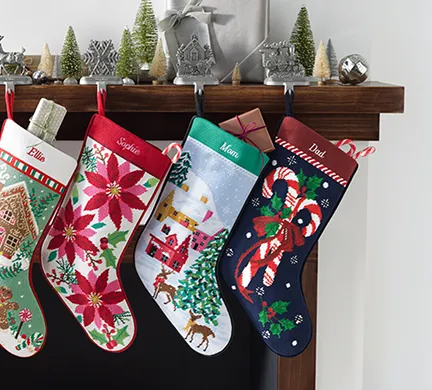 Christmas stockings hanging from a mantel.