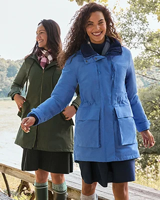 A woman wearing a light blue Squall jacket.