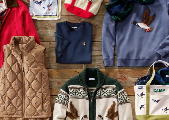 A laydown of jackets, vests, socks, scarfs, totes, and more.