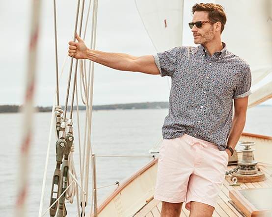 Man wearing shorts and button down shirt