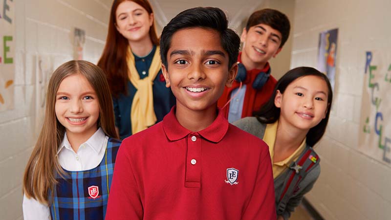 A collage of students wearing Lands’ End embroidered product.