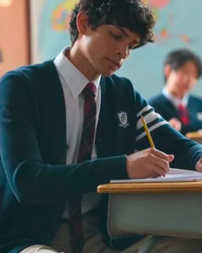 A student taking a test at his desk.