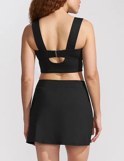 Woman wearing a maximum coverage swimsuit