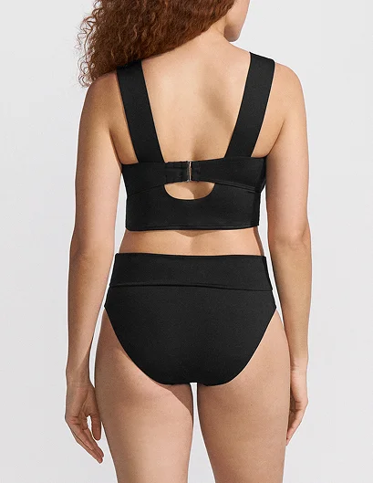 Woman wearing a moderate coverage swimsuit