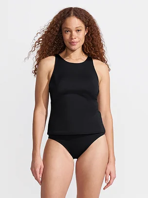 Woman wearing a high neck swimsuit