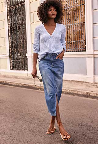 Woman wearing midi column skirt denim